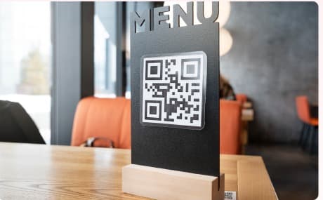 QR menu sign in a dining area